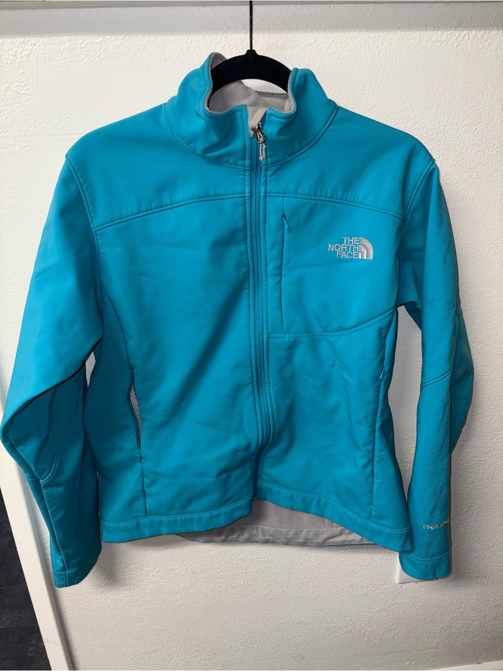 The North Face Turquoise and Gray Jacket with Logo Tag